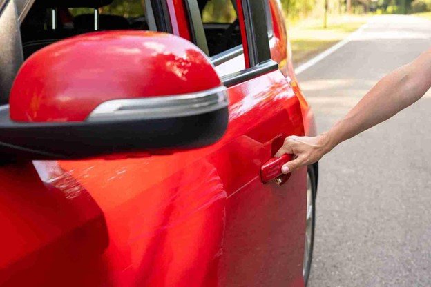 Driver waiting safely on the roadside after the car got unlocked with Cuyahoga Towing